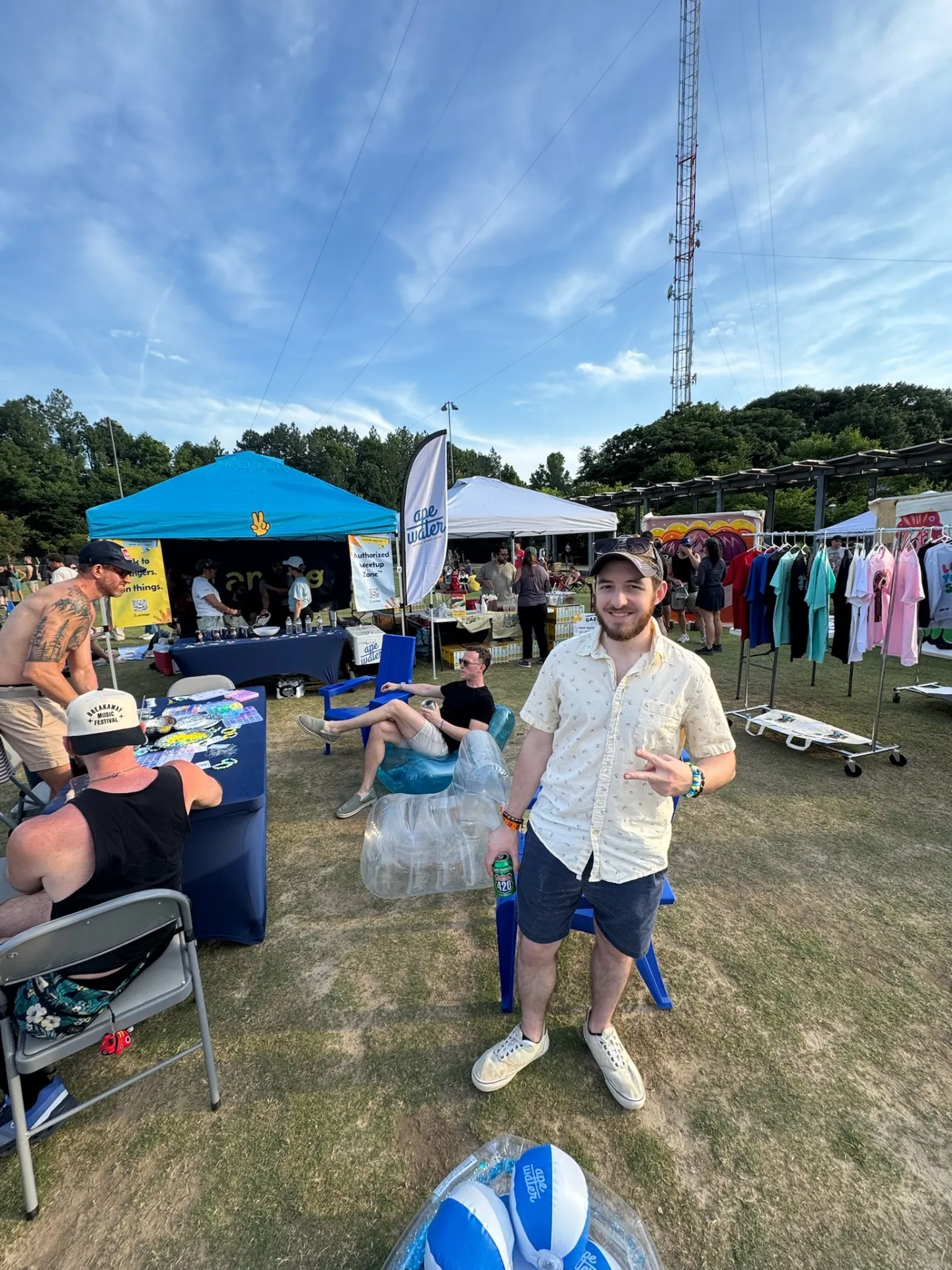 Guy at festival booth vibing