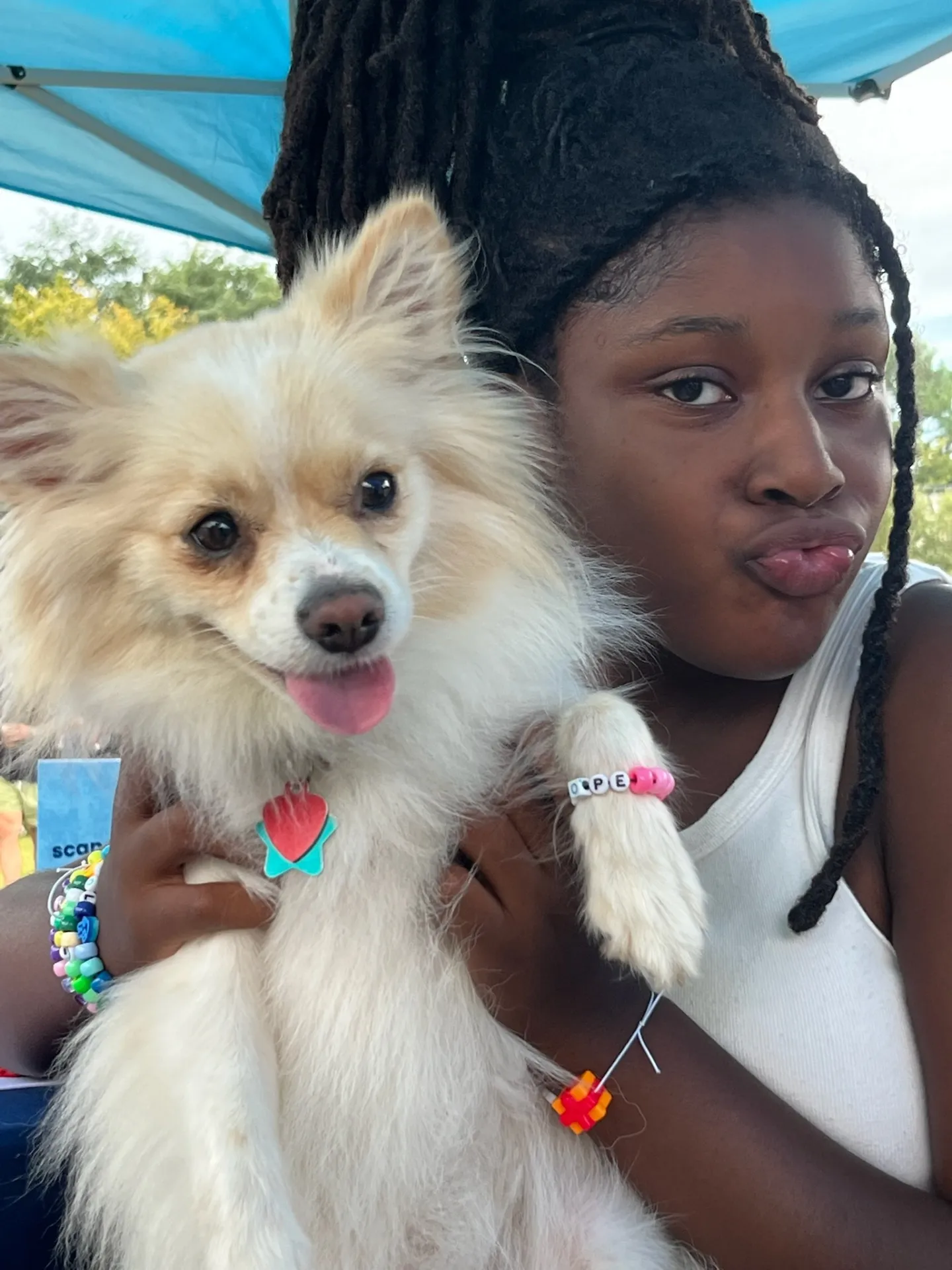 Girl with pomeranian at meetup