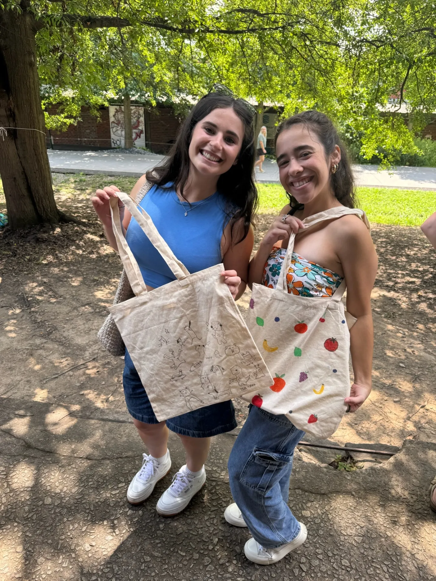 Girls showing custom tote bags